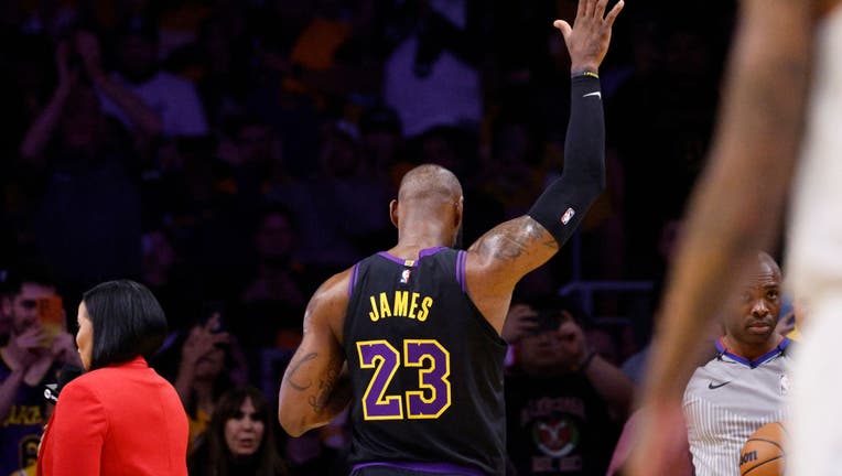LeBron James #23 of the Los Angeles Lakers acknowledges cheers from the crowd after scoring his 39,000th career point. (Photo by Kevork Djansezian/Getty Images)