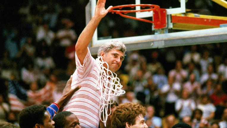 Bobby Knight coach for Indiana University mens basketball cuts down the nets to celebrate a big victory. (Photo by Getty Images)