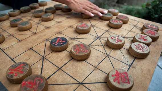 Chinese chess champ stripped of title, suspended for allegedly cheating, defecating in hotel bathtub