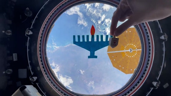 Astronaut celebrates Hanukkah from International Space Station with zero-gravity dreidel