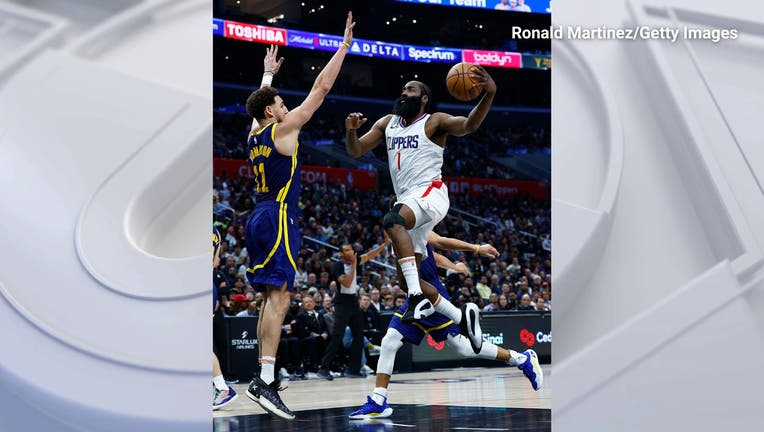 James Harden #1 of the LA Clippers takes a shot against Klay Thompson #11 of the Golden State Warriors in the second half at Crypto.com Arena on December 14, 2023 in Los Angeles, California. Ronald Martinez/Getty Images