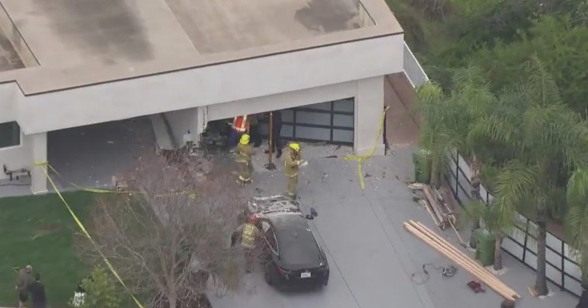 Car crashes into Granada Hills garage, 2 hospitalized | FOX 11 Los Angeles