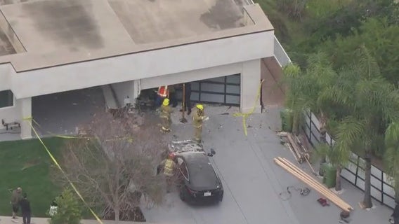 Car crashes into Granada Hills garage, 2 hospitalized