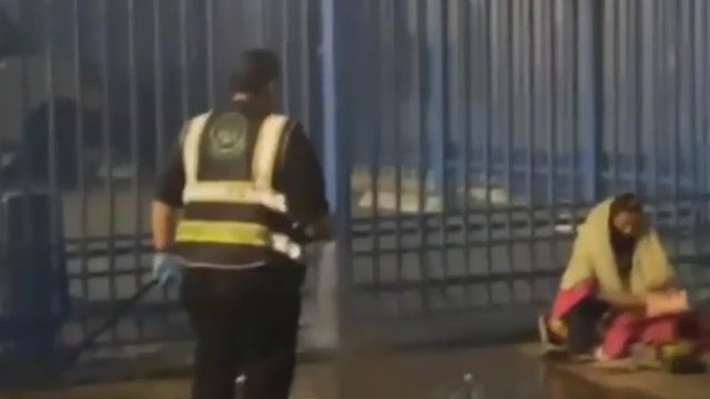 Homeless person in LA appears to get hosed by nonprofit worker spraying Skid Row sidewalk