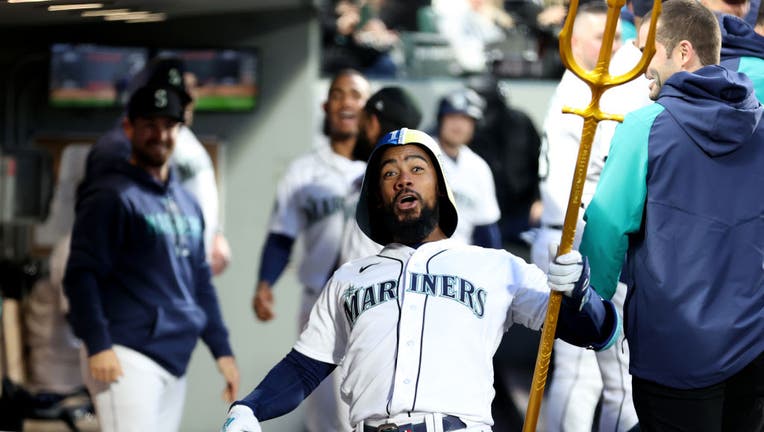 Teoscar Hernandez #35 of the Seattle Mariners celebrates his home run with the celebration trident during the fourth inning against the St. Louis Cardinals at T-Mobile Park on April 21, 2023 in Seattle, Washington. (Photo by Steph Chambers/Getty Images)