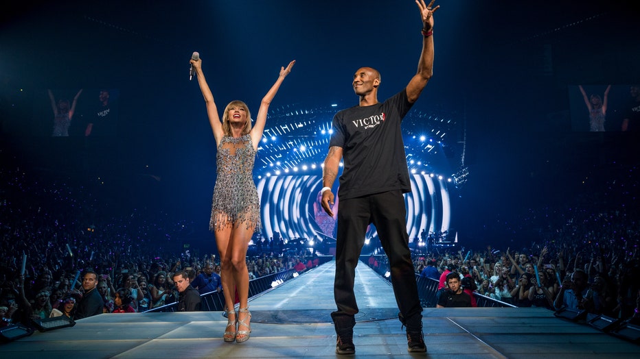 Singer-songwriter Taylor Swift (L) and NBA player Kobe Bryant speak onstage during The 1989 World Tour Live In Los Angeles at Staples Center on August 21, 2015 in Los Angeles, California. (Photo by Christopher Polk/Getty Images for TAS)