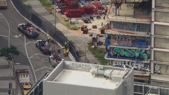 Crews begin building fence around downtown LA’s graffiti tower