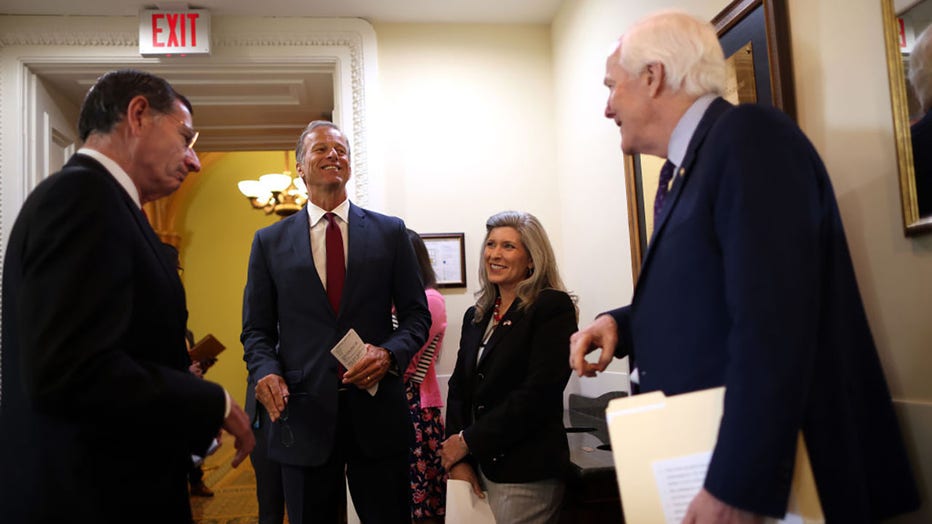 FILE - (L-R) Sen. John Barasso (R-WY), Sen. John Thune (R-SD), Sen. Marsha Blackburn (R-TN) and Sen. John Cornyn (R-TX) talk prior to a press conference on a proposed Democratic tax plan, at the U.S. Capitol on August 04, 2021 in Washington, DC. (Photo by Kevin Dietsch/Getty Images)