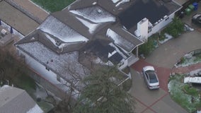 Fast-moving storm drenches LA with rain and hail