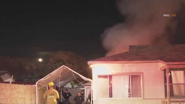 Teen rescued, grandma found dead in Pacoima garage fire