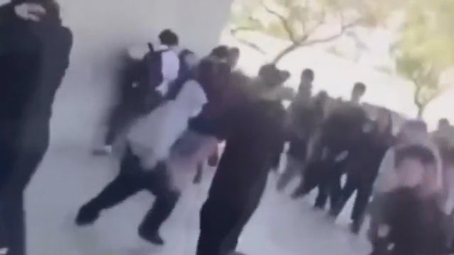 Video shows person pulling out gun in front of students at school in Pomona