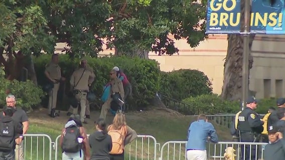 UCLA cancels classes after night of violence at pro-Palestinian encampment