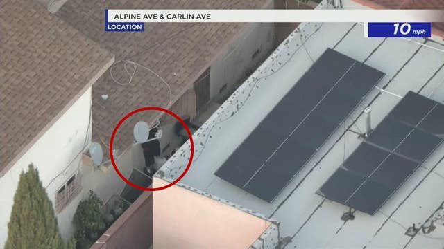 Suspects in custody after police chase suspect jumps into window of home