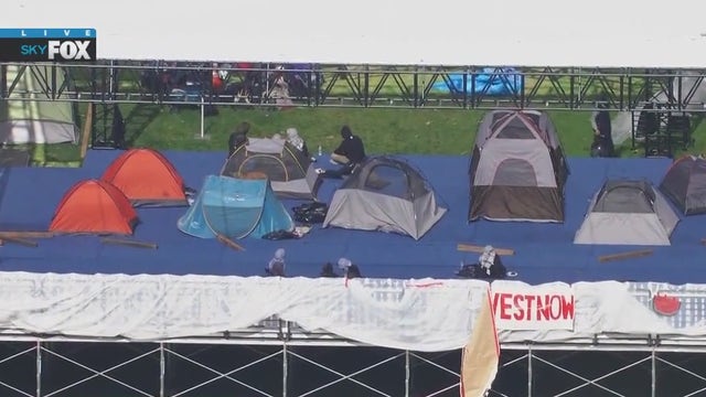 Pro-Palestine protesters take over Pomona College graduation stage