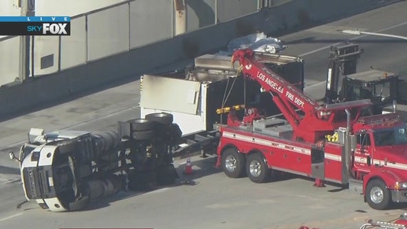 San Pedro freeway reopened after big rig carrying lithium-ion batteries sparks fire