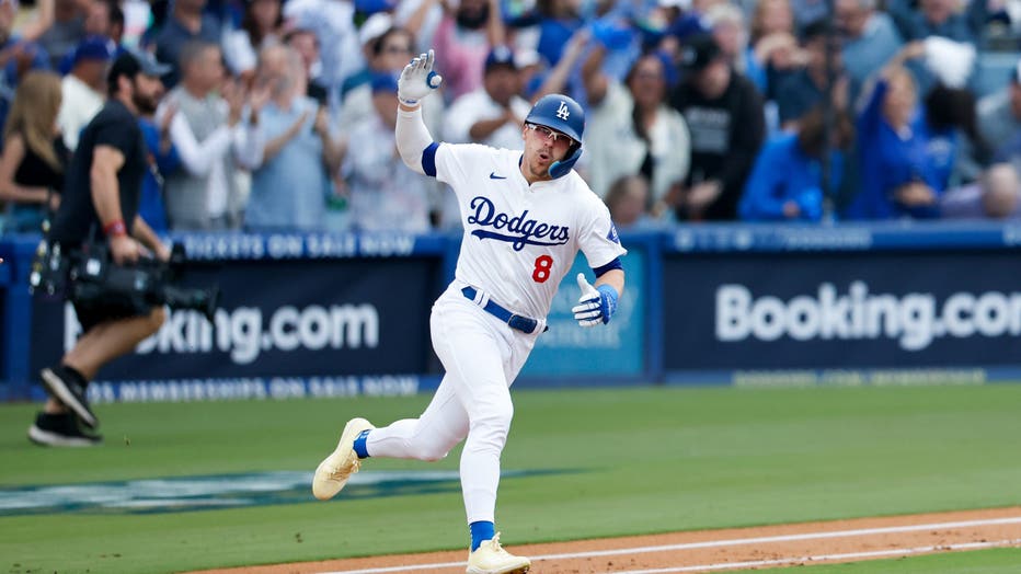 Enrique Hernandez #8 of the Los Angeles Dodgers celebrates while rounding first base on a solo home run during the second inning in game five of the National League Division Series against the San Diego Padres at Dodger Stadium on Friday, Oct. 11, 2024 in Los Angeles. (Gina Ferazzi / Los Angeles Times via Getty Images)