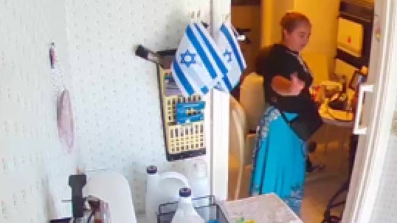 WATCH: Woman steals Holocaust survivor's diamond necklace, ring off her body