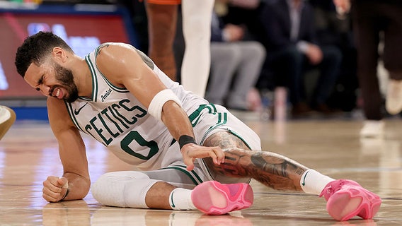 Jayson Tatum helped off the court after suffering leg injury in Game 4 against Knicks