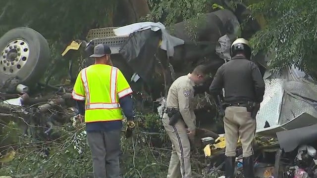 Semi crashes through 210 Freeway wall in Arcadia