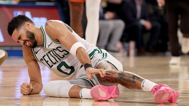 Jayson Tatum helped off the court after suffering leg injury in Game 4 against Knicks