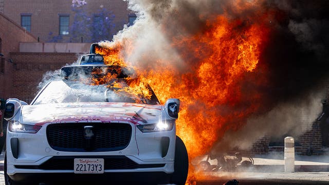 Waymo cars set on fire as Los Angeles immigration raids protests continue