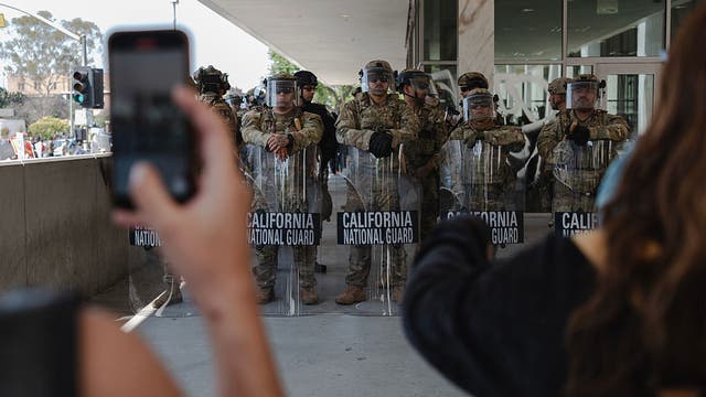 LA protests: Riot gear distributed by masked group sparks questions