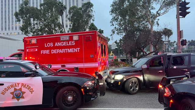 Woman arrested after allegedly driving car into LAFD ambulance