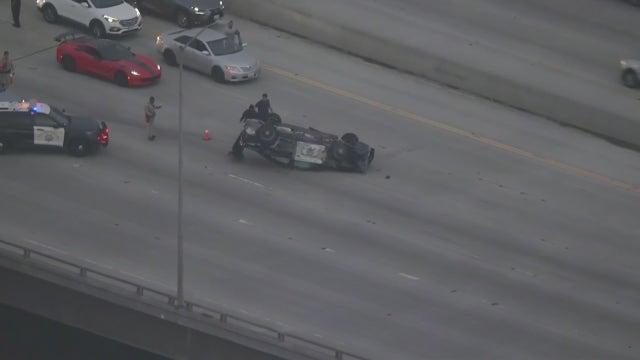 Cop car flips over following pursuit in Long Beach