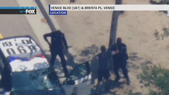 Pursuit suspect in custody after throwing punch at LAPD officer