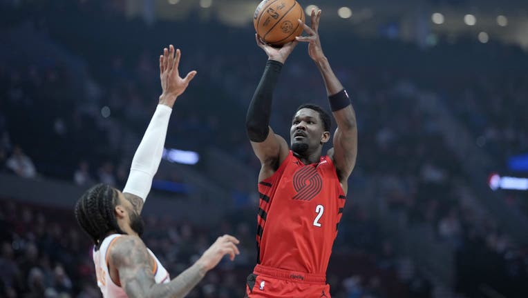 Deandre Ayton #2 of the Portland Trail Blazers shoots the ball over Nick Richards #2 of the Phoenix Suns during the first half at Moda Center on February 03, 2025 in Portland, Oregon. NOTE TO USER: User expressly acknowledges and agrees that, by downloading and or using this photograph, User is consenting to the terms and conditions of the Getty Images License Agreement. (Photo by Soobum Im/Getty Images)
