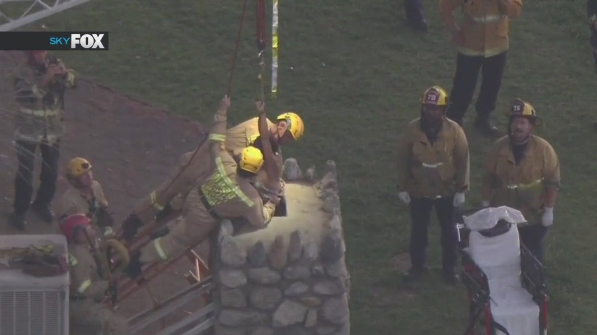 Crews pull woman out of chimney in San Fernando