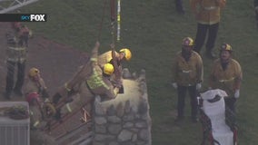 Crews pull woman out of chimney in San Fernando