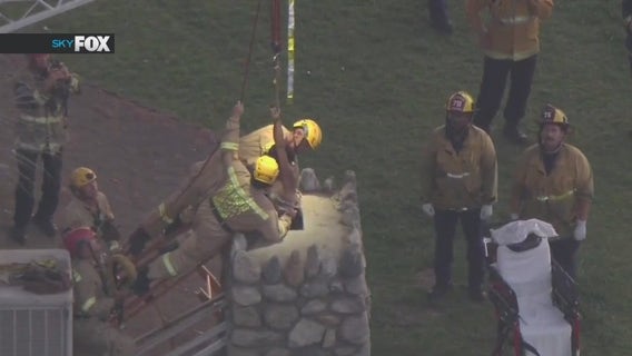 Crews pull woman out of chimney in San Fernando