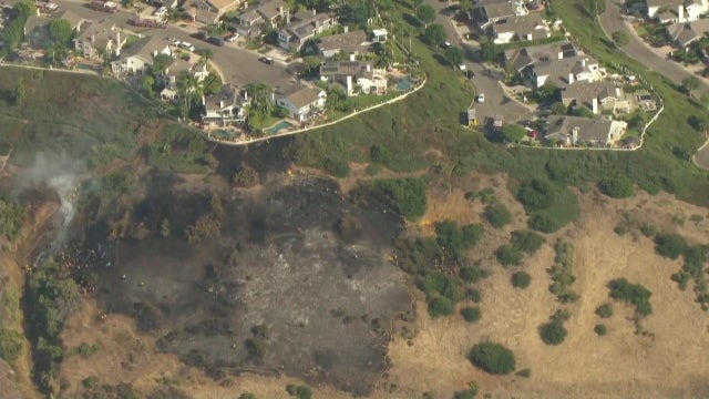 VIDEO: Firefighters stop Beacon Fire from reaching nearby home in Laguna Niguel