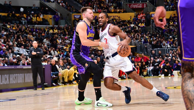 Kawhi Leonard #2 of the LA Clippers handles the ball while Luka Doncic #77 of the Los Angeles Lakers plays defense during the game on February 28, 2025 at Crypto.Com Arena in Los Angeles, California. NOTE TO USER: User expressly acknowledges and agrees that, by downloading and/or using this Photograph, user is consenting to the terms and conditions of the Getty Images License Agreement. Mandatory Copyright Notice: Copyright 2025 NBAE (Photo by Adam Pantozzi/NBAE via Getty Images)
