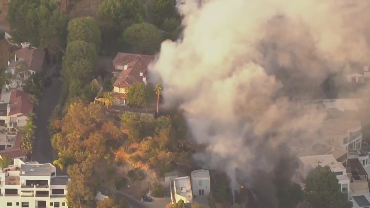 LIVE: Hollywood Hills fire burning down homes, cars