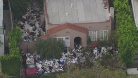 LA's infamous 'trash house' is buried in trash bags again