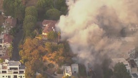 Hollywood Hills car fire sparks small brusher