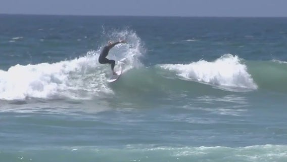 Southern California beach-goers face heat and hazardous weather conditions