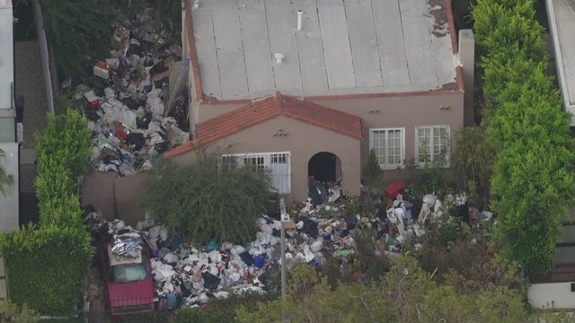 LA's infamous 'trash house' is buried in trash bags again