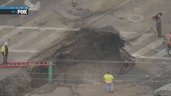Crews work to repair massive sinkhole in Orange