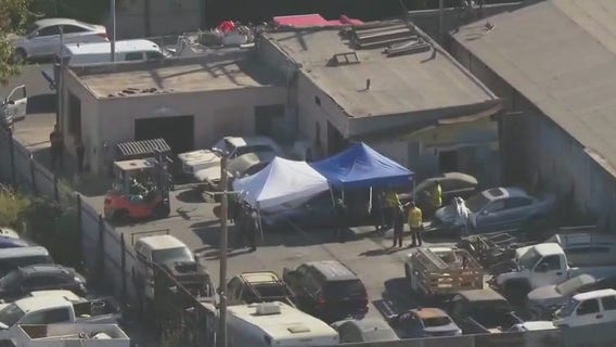 Arrest made after body found in car at South LA tow yard