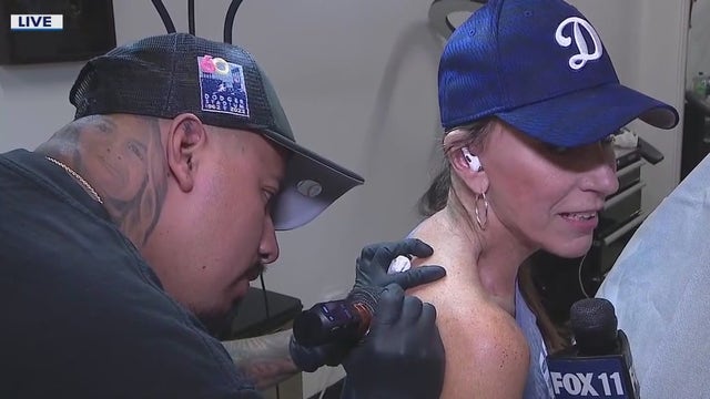 Fans, including FOX 11 reporter, getting Dodgers tattoos amid World Series run