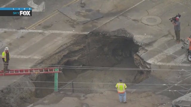 Crews work to repair massive sinkhole in Orange