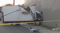 Box truck plows into South LA building; 2 injured