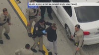 Driver arrested after pursuit, standoff on 101 Freeway in Hollywood