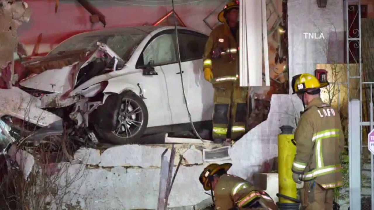 2 injured after Tesla plows into LA home near 5 Freeway