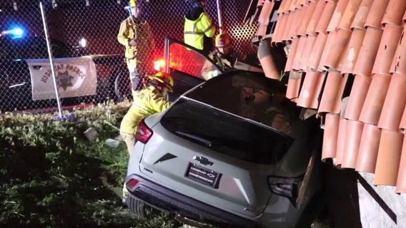 Car flies off 101 Freeway, lands on Woodland Hills strip mall roof