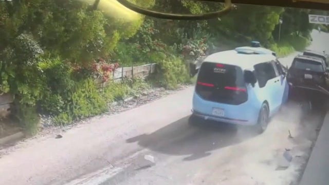 Video shows Waymo van crashing into parked cars