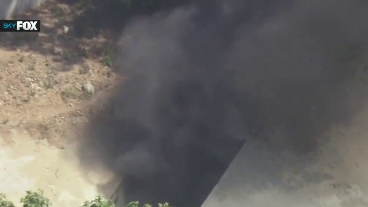 Stolen car pursuit ends in tunnel fire, sending smoke through Highland Park sewers